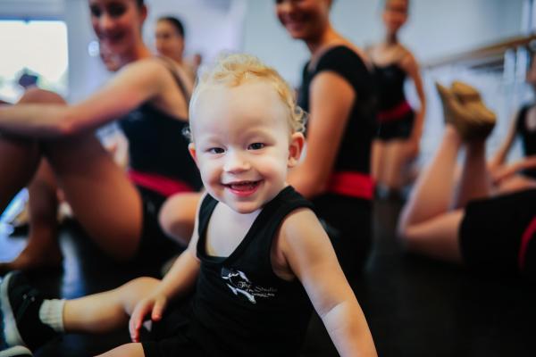 A colour photo of a child loving dance classes