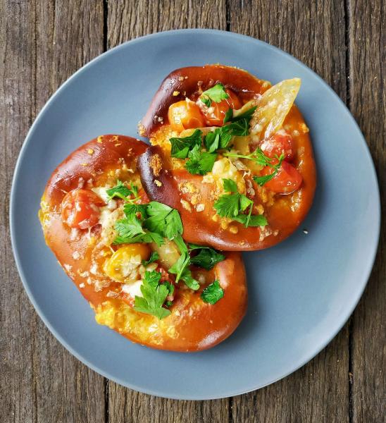 Confit tomatoes and cheese on pretzel flatbread