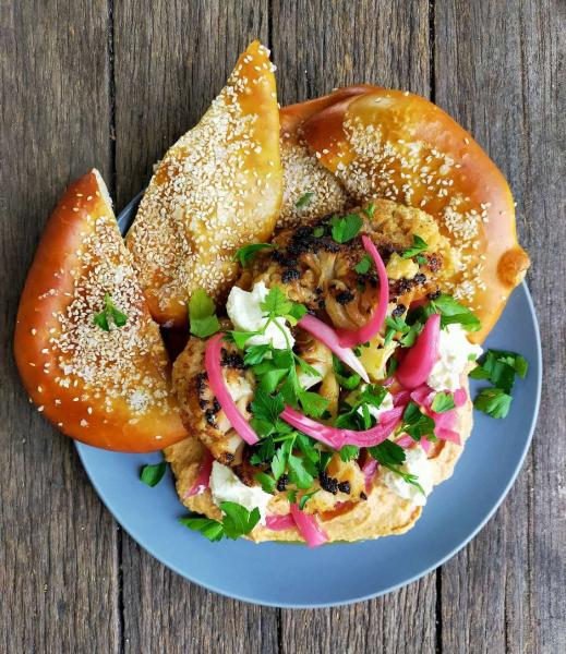 Roast cauliflower, confit garlic humus, pickled pink onions, pretzel flatbread