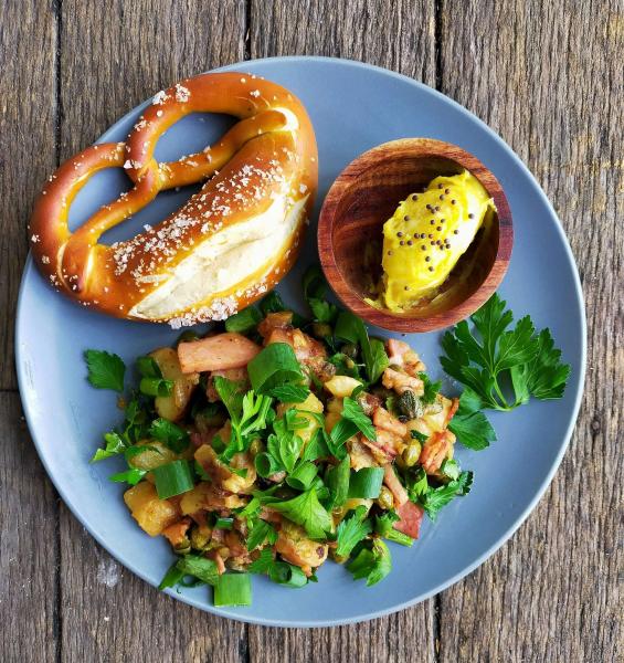 Salty pretzel, mustard butter, warm potato salad